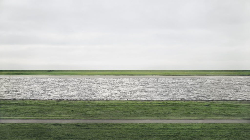 This 1999 photograph provided by Chrisitie's shows the Rhine river by German artist Andreas Gursky. Titled "Rhein II," the chromogenic color print face-mounted to acrylic glass was sold for $4.3 million Tuesday, Nov. 8, 2011, at Christie's in New York City, setting a record for any photograph sold at auction. (AP Photo/Christie's, Andreas Gursky)